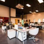 ct-people-sitting-on-chairs-beside-their-desks-in-an-office-1170412